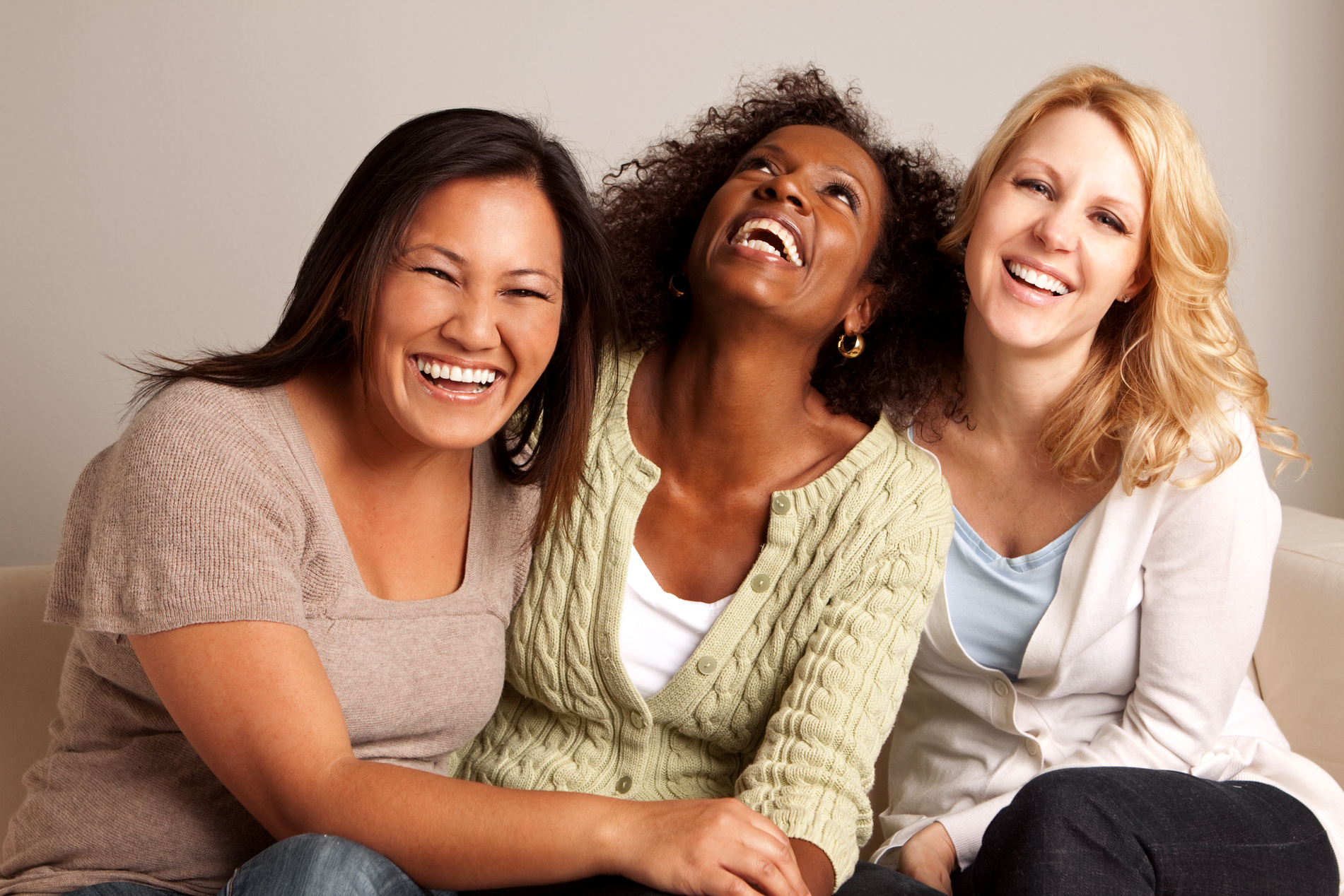 Diverse group of women laughing together
